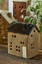 Maison avec bougie chauffe-plat porte crème